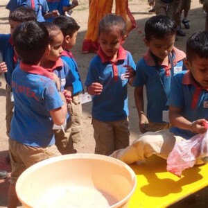 Students celebrating Holi festival at school