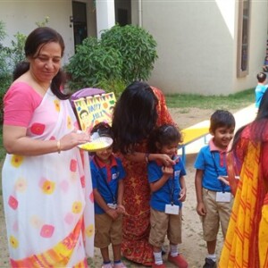 Students celebrating Holi festival at school
