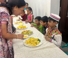 Class 1 students presenting Indian state-wise famous food exhibition