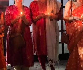 Students performing Maa Narmada Aarti with Divya Bhaskar